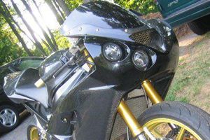 Oppracing carbon fairings with custom projector headlight on 
kawasaki zx6r
